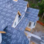 How Underlayments, Snow Retention and Sealants Work Together in Cold-Weather Roofing